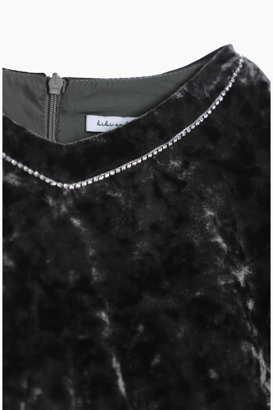 The KIKI and JOJO Girls Velvet Puff Sleeve Dress in Forest Green features a back zipper and rhinestone trim along the neckline—an elegant choice for special occasions.
