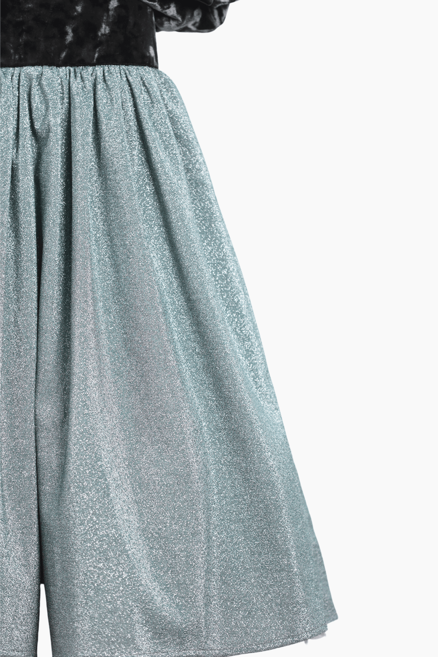 The KIKI and JOJO Girls Velvet Puff Sleeve Dress with Rhinestone Trim in forest green features elegant puff sleeves and sparkling accents, shown from the waist down against a white background—ideal for special occasions.