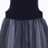 The KIKI and JOJO Girls Velvet & Tulle Dress in Sapphire Blue features a sleeveless, dark blue velvet bodice and layered matching tulle skirt—perfect for special occasions, shown on a white background.