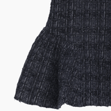 Close-up of the KIKI and JOJO Girls Vintage Beaded Tweed Wave-Hem Dress in gray, featuring a flared, ruffled hem—ideal for special occasions.