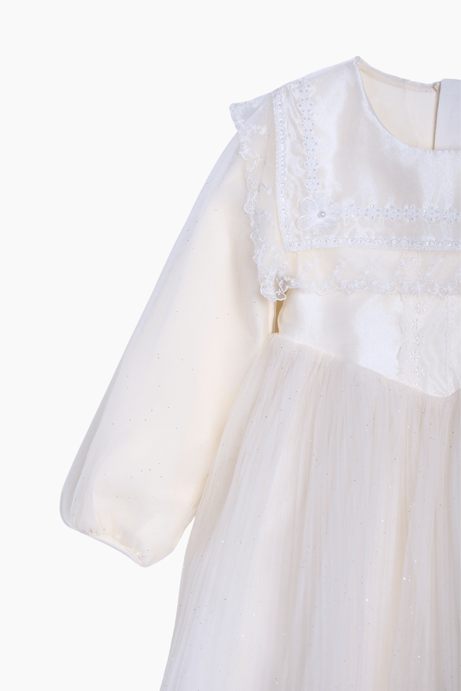 A close-up of the KIKI and JOJO Girls Vintage Lace Satin & Tulle Dress in beige, featuring puffed sleeves, a sheer skirt, and delicate hand-embroidered floral details, shown on a white background.