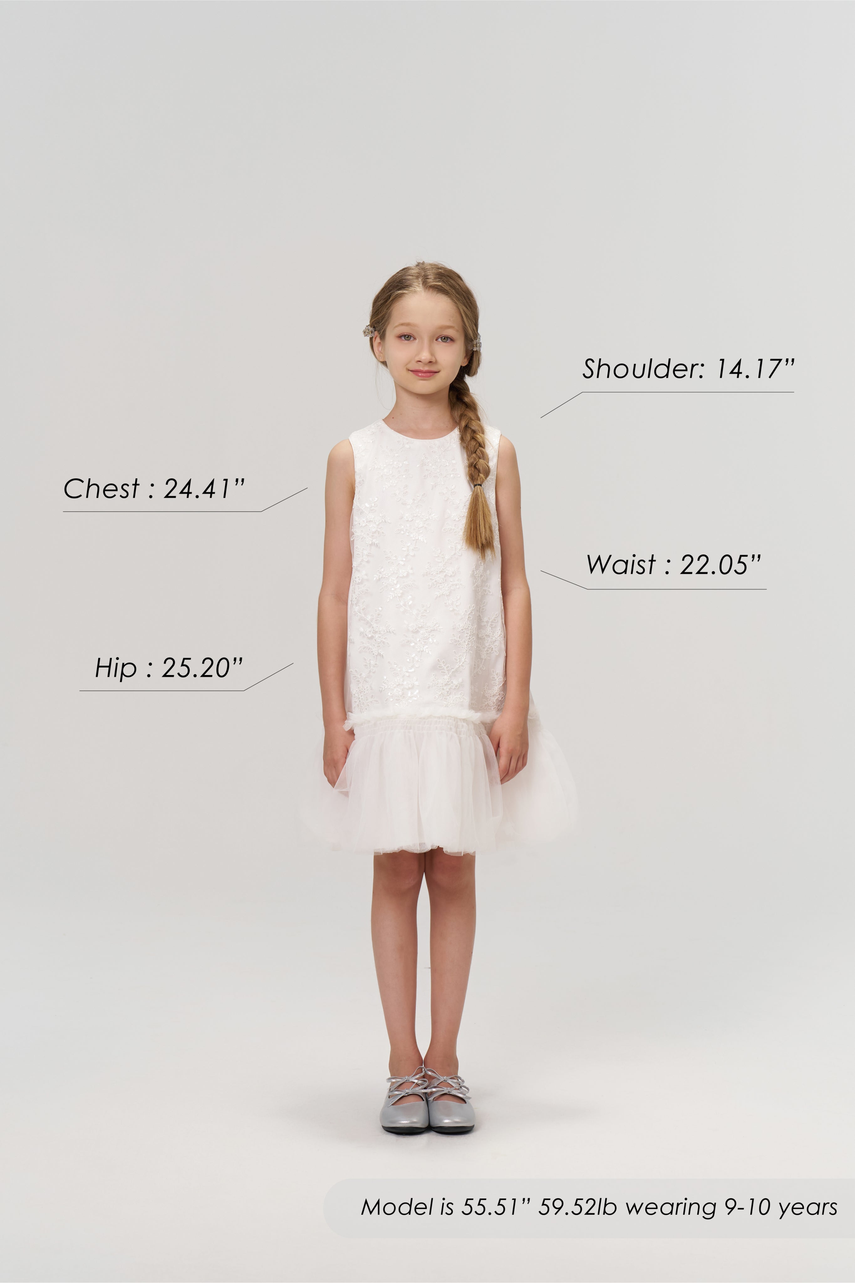 A young girl models the KIKI and JOJO Twinkle Whisper Dress, a white A-line style with delicate embroidered lace, paired with gray shoes. She is 55.51" tall, weighs 59.52 lb, wears size 9-10 years; chest, shoulder, waist, and hip labeled.